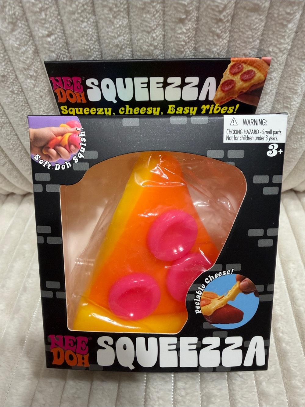 NeeDoh SQUEEZZA Pizza Slice Squishy Toy. New in sealed box.